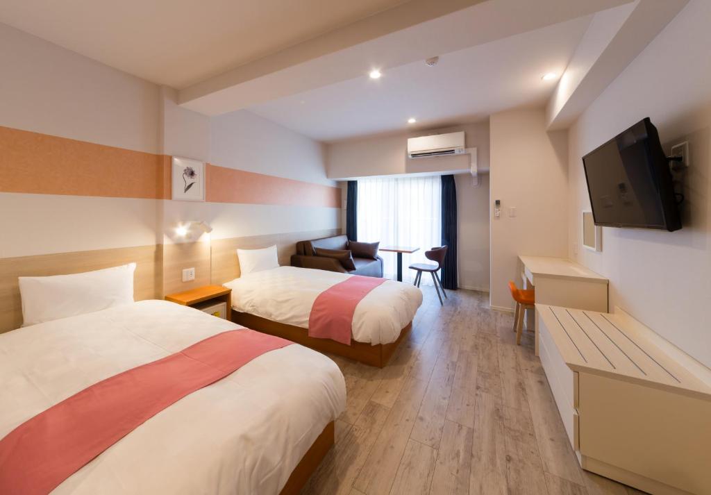 Postel nebo postele na pokoji v ubytování SARASA HOTEL Namba