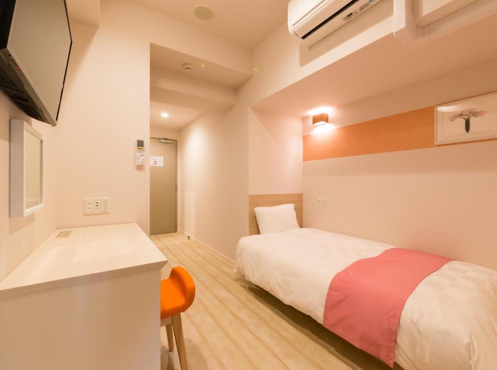 Postel nebo postele na pokoji v ubytování SARASA HOTEL Namba