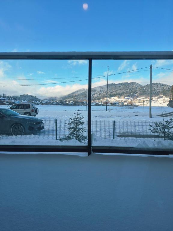 a view from a window of a parking lot at Bakuriani Plaza A block N109 in Bakuriani