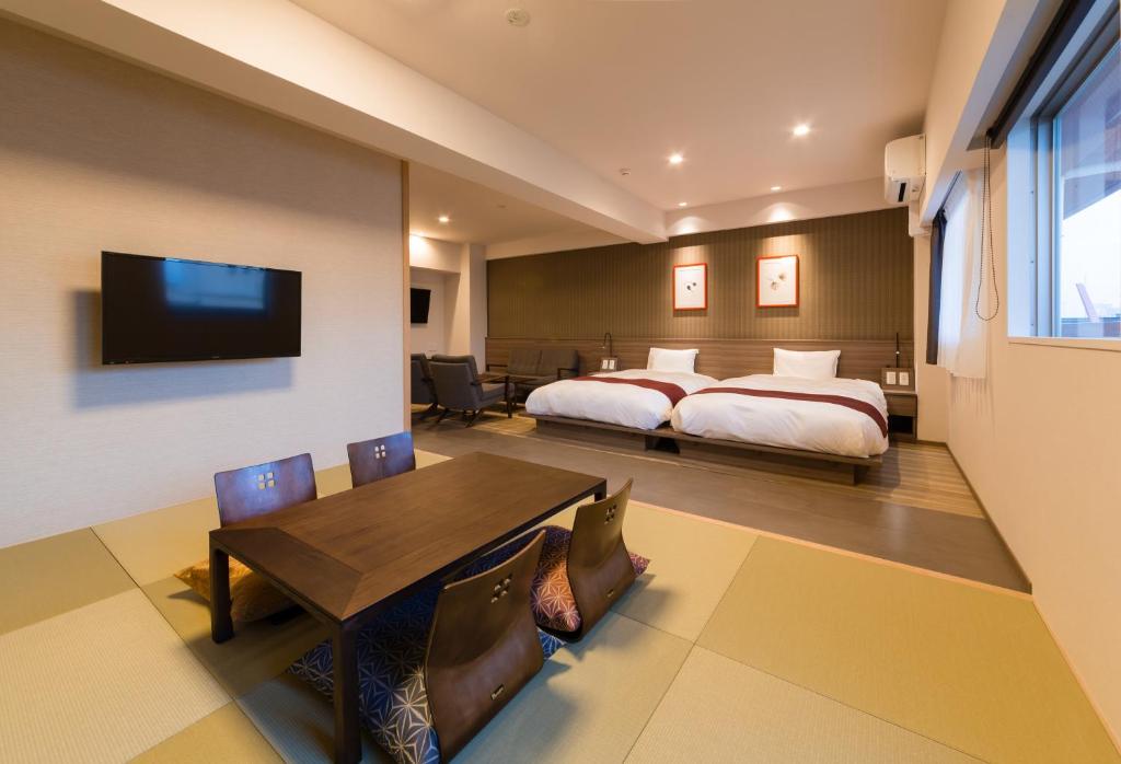 Postel nebo postele na pokoji v ubytování SARASA HOTEL Namba