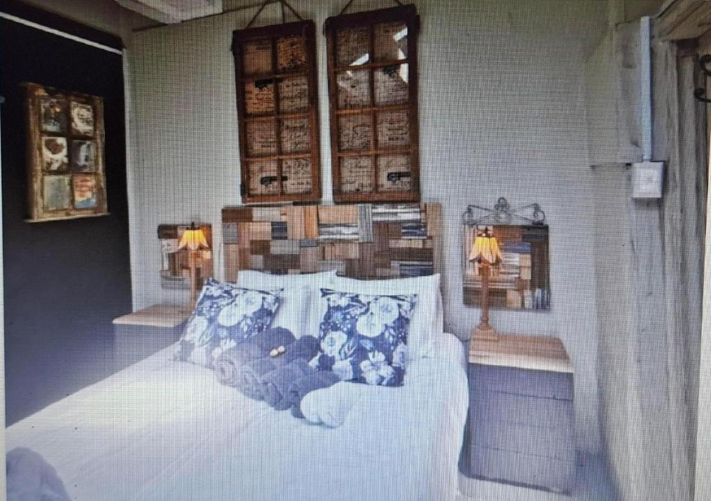 a bedroom with a bed with two teddy bears on it at SomethingElz@Grace in Pretoria