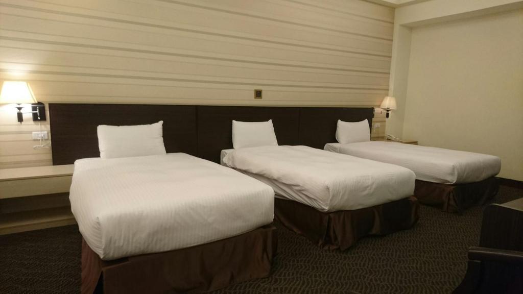 Postel nebo postele na pokoji v ubytování Dreamer Hotel