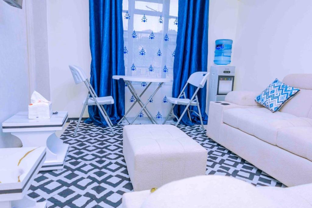 a living room with a couch and a table at GILGAL Homes in Kisii