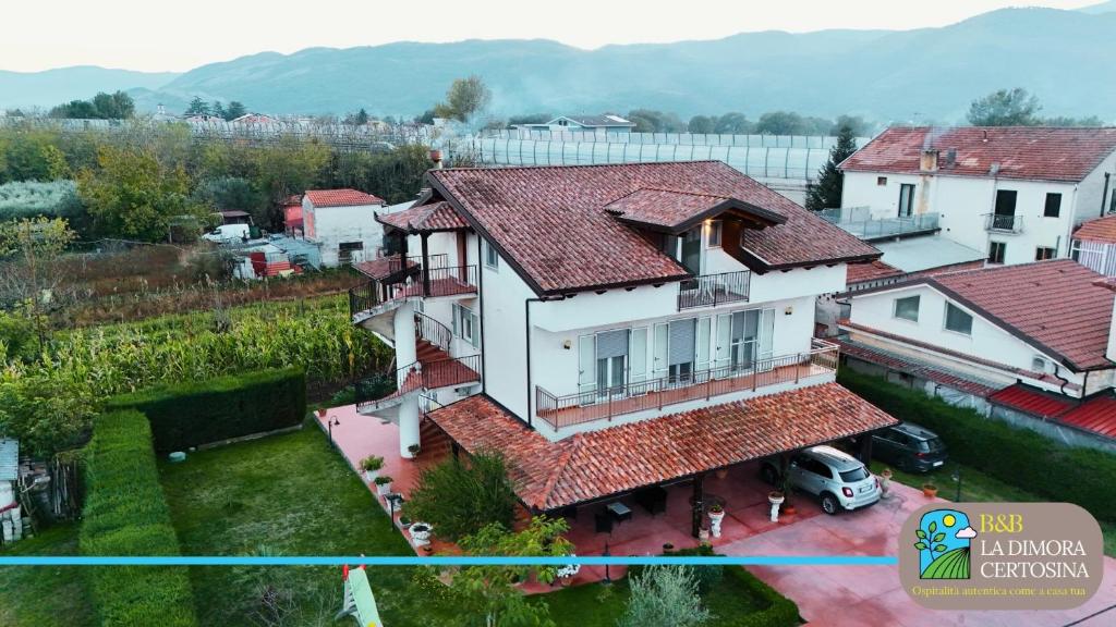 an aerial view of a house with red roof at La Dimora Certosina in Padula