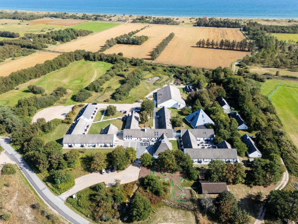 an aerial view of a large estate with houses at Hotel Hvide Klit in Ålbæk