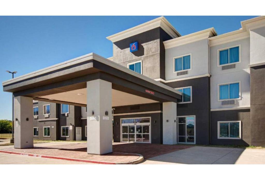 a rendering of a hotel with a building at Motel Worth, TX in Fort Worth