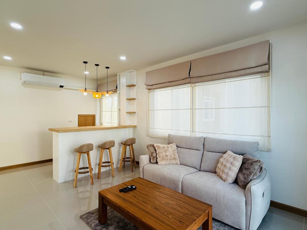 a living room with a couch and a table at House in HangDong in Hang Dong