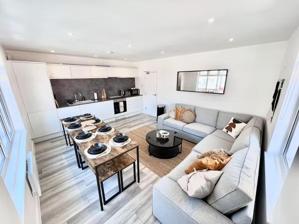 a living room with a couch and a table at 9a Westham road in Weymouth