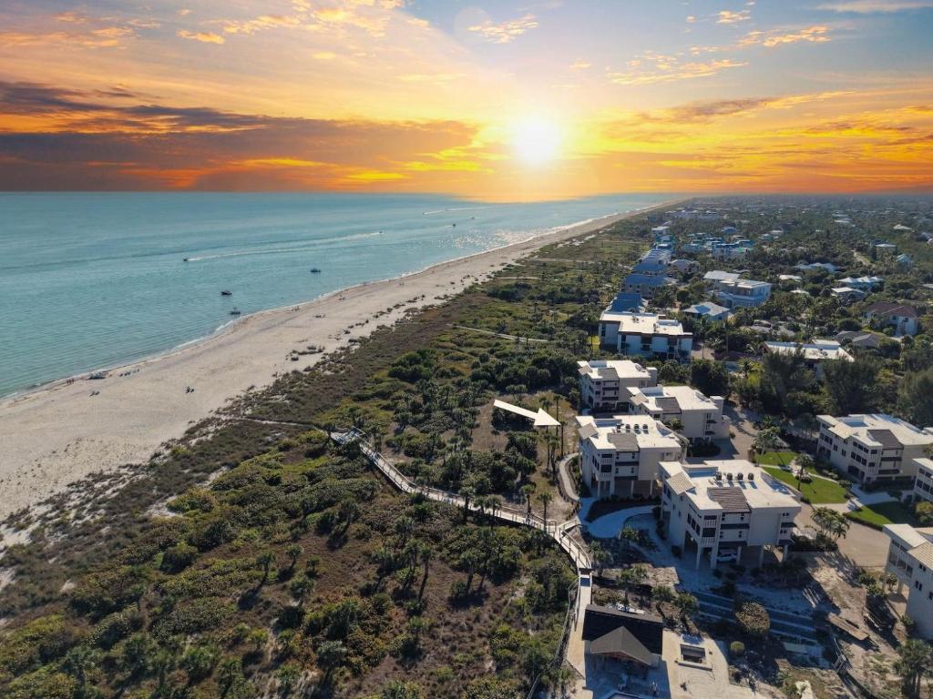 an aerial view of the beach at sunset at Shell Island Beach Club #5D in Sanibel