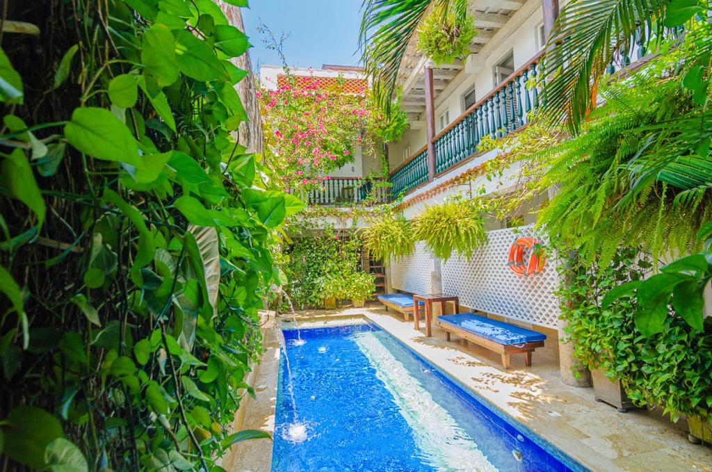 a swimming pool in the middle of a building at Casa Pizarro Hotel Boutique in Cartagena de Indias