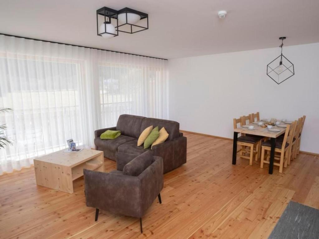 a living room with a couch and a table at Apartment Duai by Interhome in Müstair