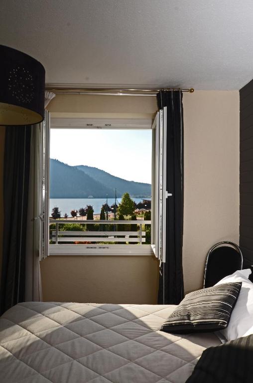 Postel nebo postele na pokoji v ubytování Hôtel La Réserve