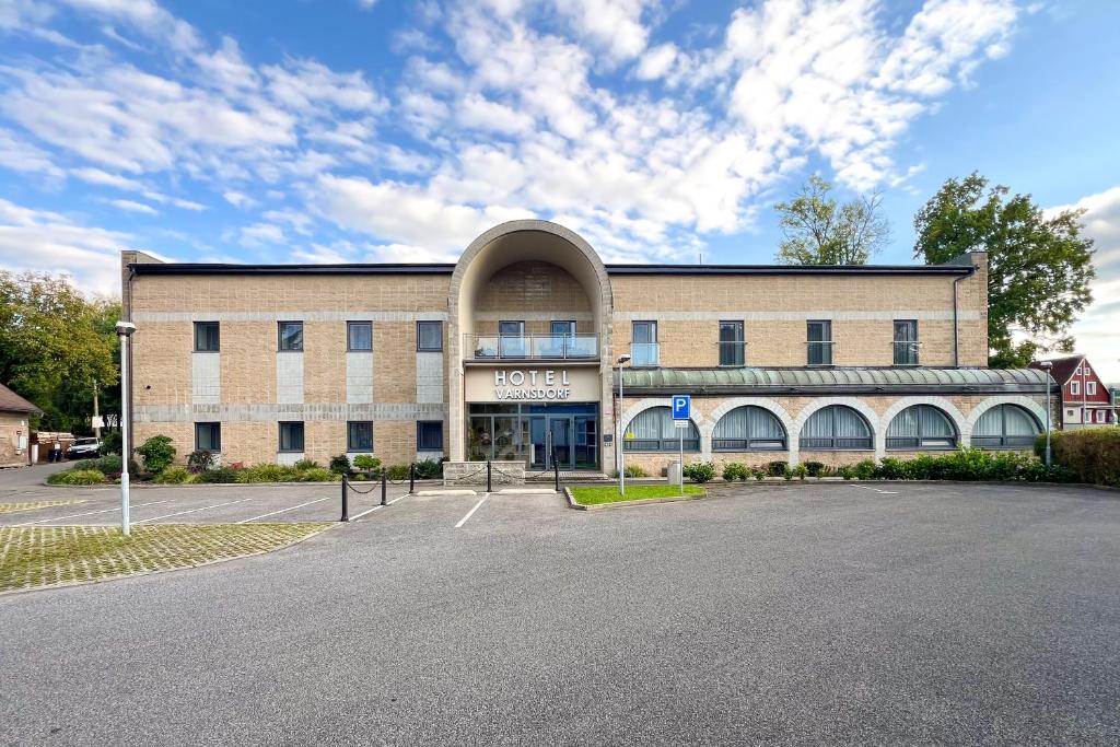 an empty parking lot in front of a building at Hotel VARNSDORF in Varnsdorf