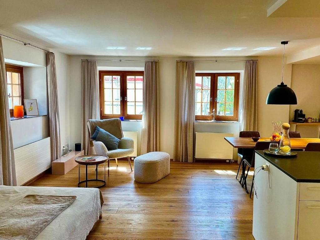 a living room with a kitchen and a dining room at Apartment casa M by Interhome in Vella