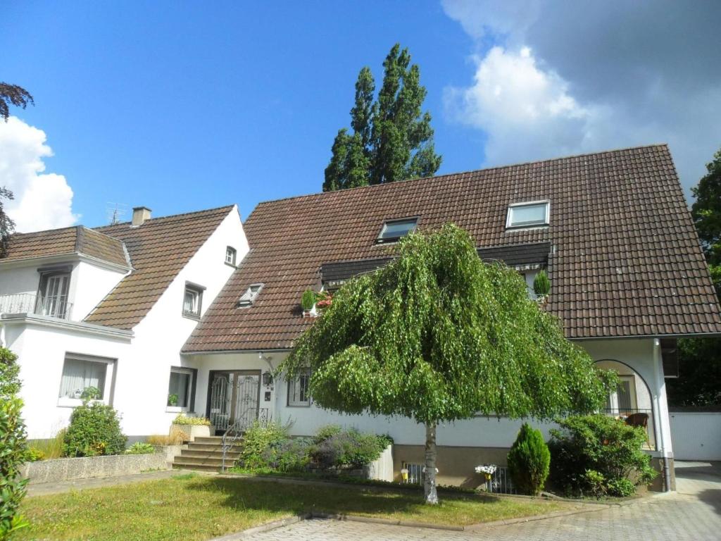 a white house with a brown roof at Apartment Becker by Interhome in Bad Neuenahr-Ahrweiler