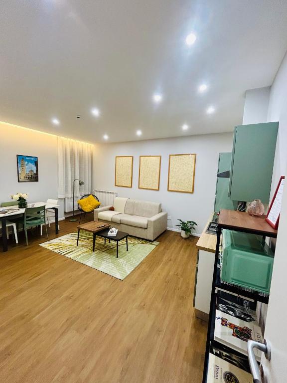 a living room with a couch and a table at AB apartment Pistoia in Pistoia