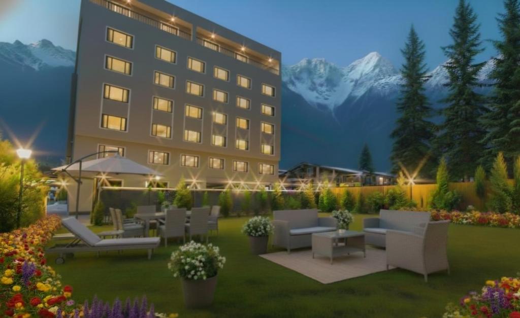 a rendering of a hotel patio with tables and chairs at Solar Residency, Srinagar in Srinagar