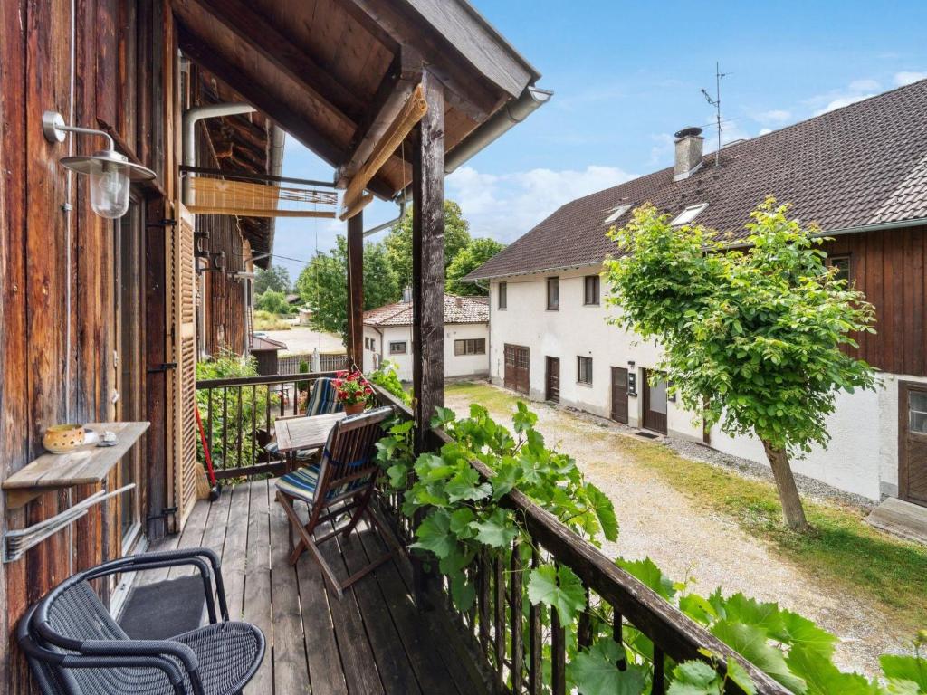 a balcony with a table and chairs on a house at Apartment Spiegl by Interhome in Waizacker