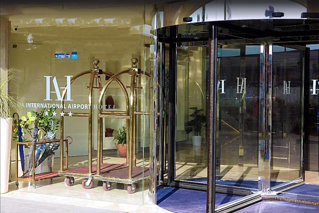 an entrance to a store with two glass doors at Catania International Airport Hotel in Catania