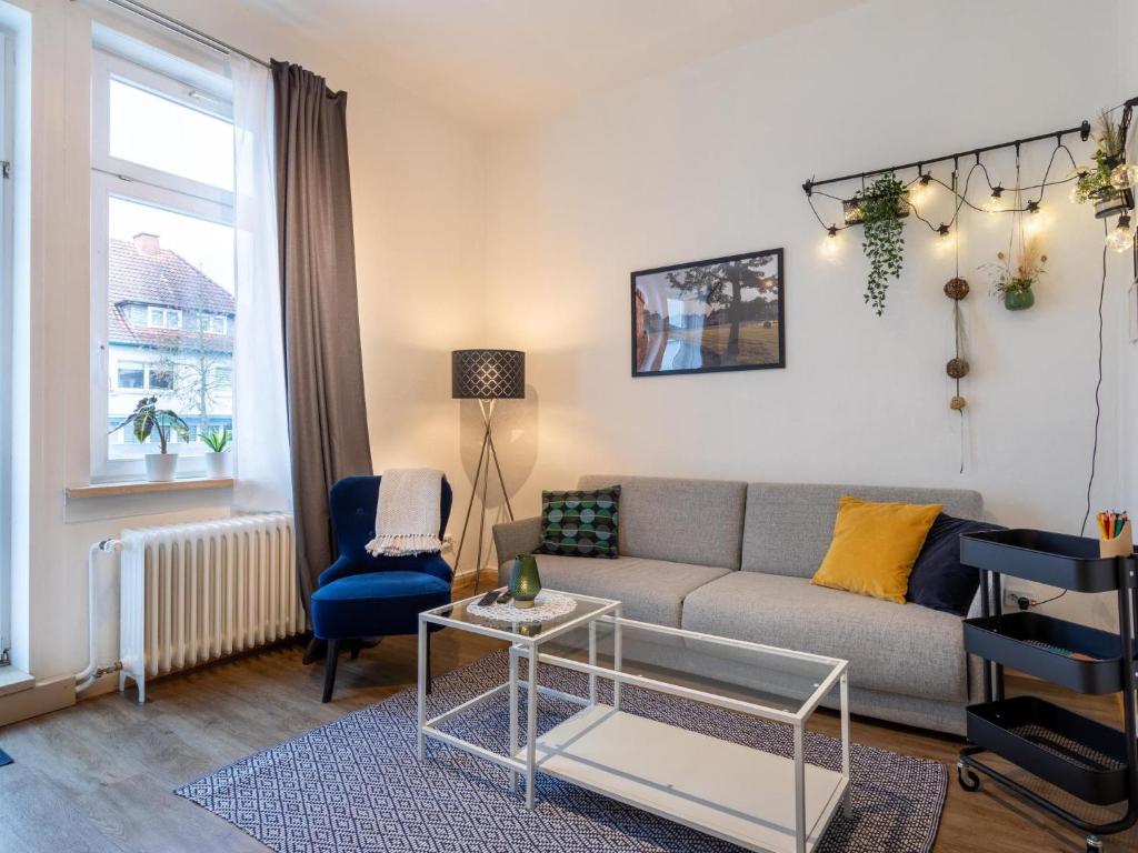 a living room with a couch and a chair at Apartment Apartment 54 by Interhome in Bad Arolsen