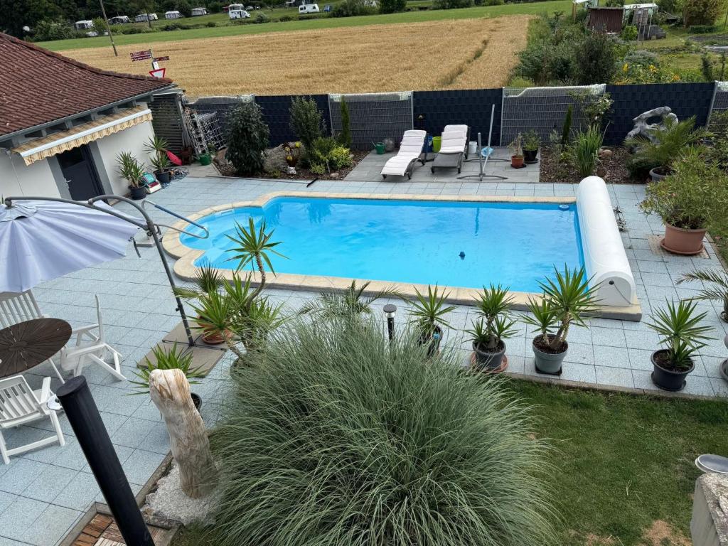 an overhead view of a swimming pool with plants at Apartment Lahn-Paradies by Interhome in Aull
