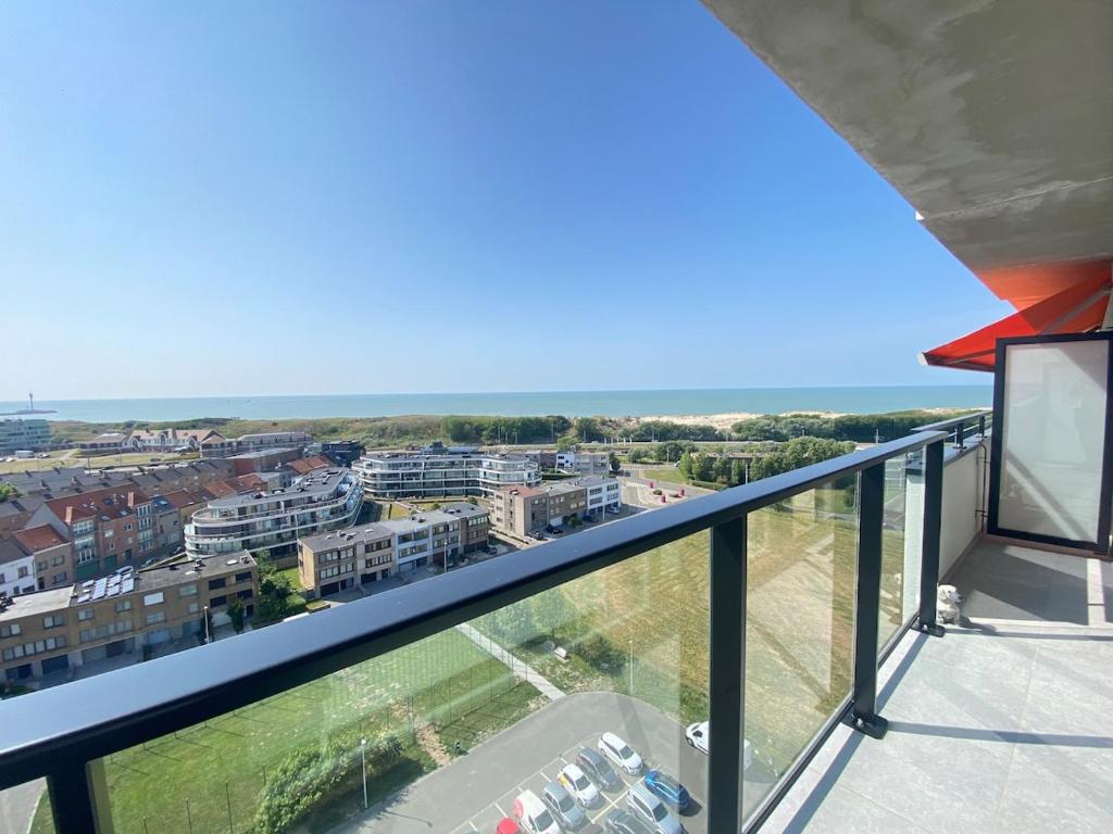 a balcony with a view of the ocean at Joy at sea in Bredene-aan-Zee