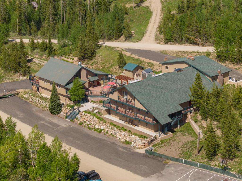 an aerial view of a house with a green roof at Hideaway Mountain Lodge in Fraser