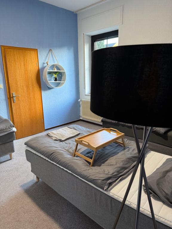 a room with a bed with a table on it at Bettina City Flat - Ground Floor in Werne an der Lippe