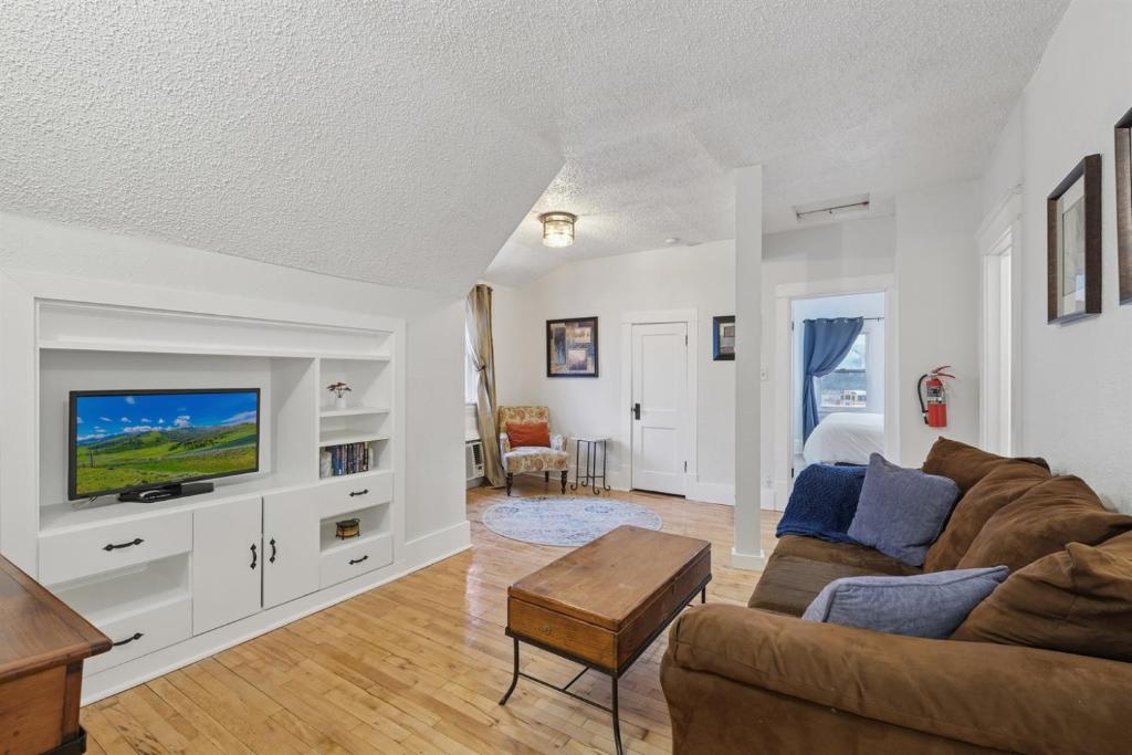a living room with a couch and a tv at 1BR Apartment Across from Como Lake - Bayberry in Saint Paul