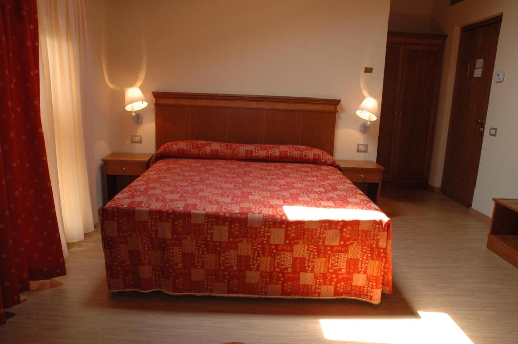 Postel nebo postele na pokoji v ubytování Hotel Il Borghetto