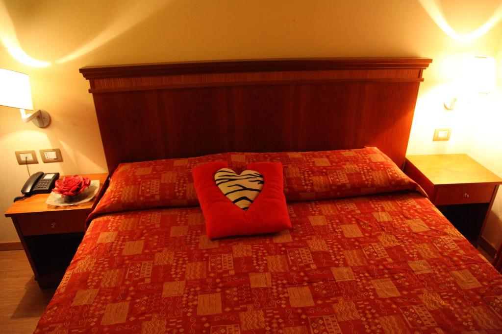 Postel nebo postele na pokoji v ubytování Hotel Il Borghetto