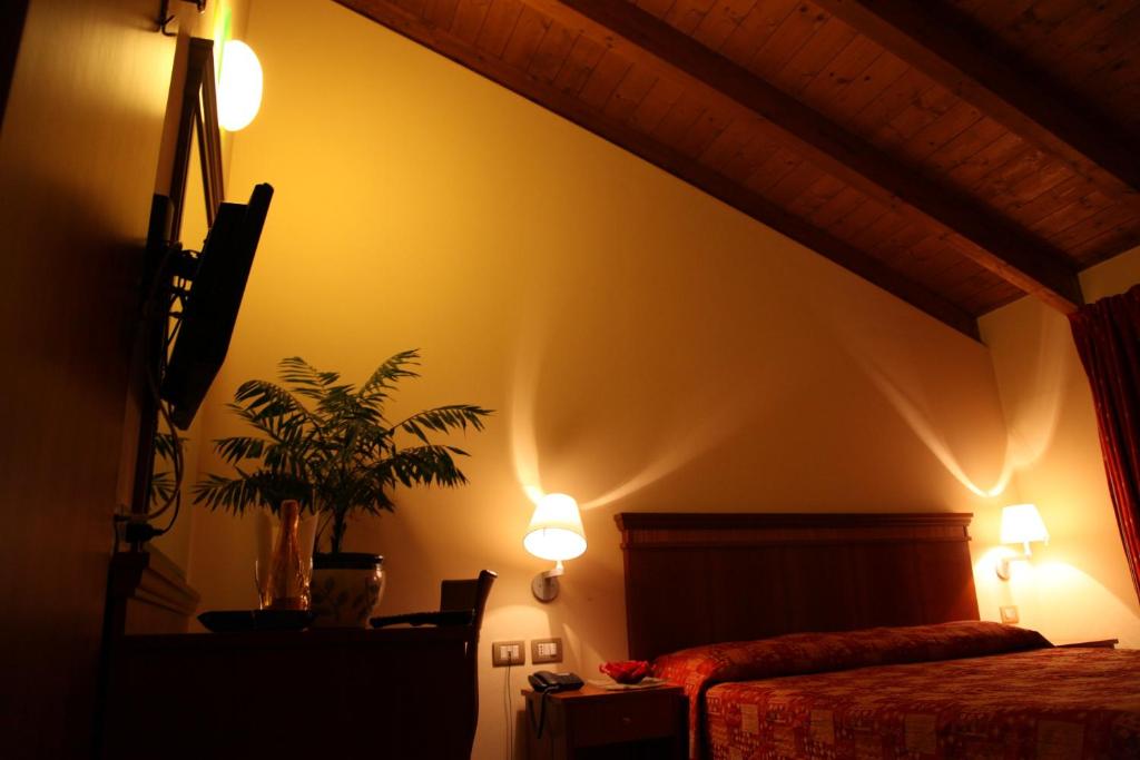 Postel nebo postele na pokoji v ubytování Hotel Il Borghetto