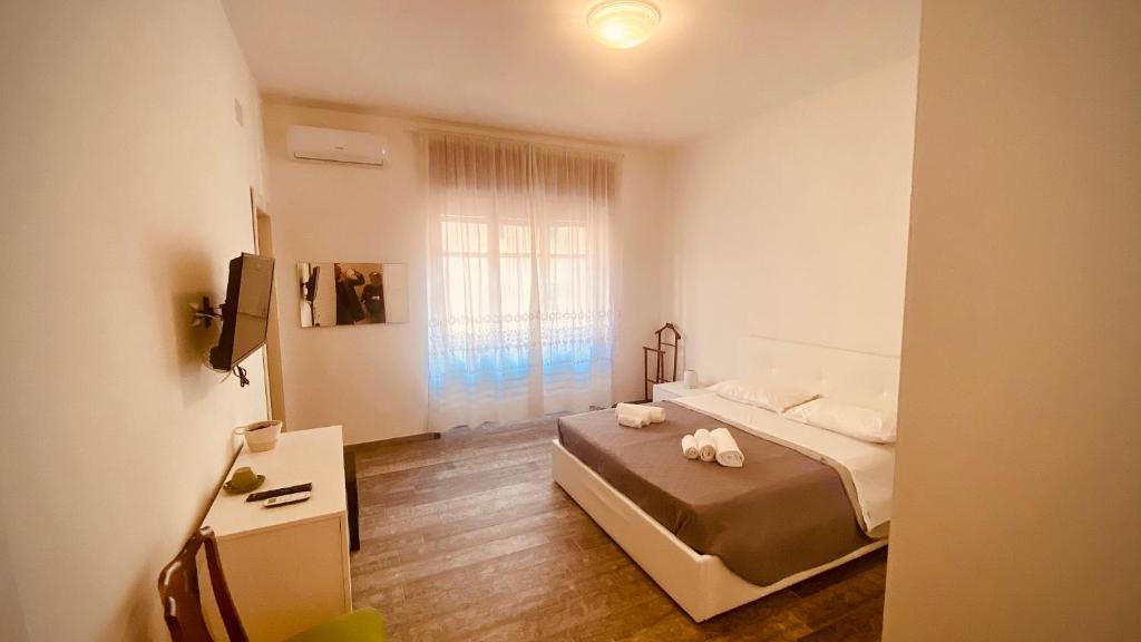 a bedroom with a bed with two stuffed animals on it at Art home Amalfi coast in Salerno