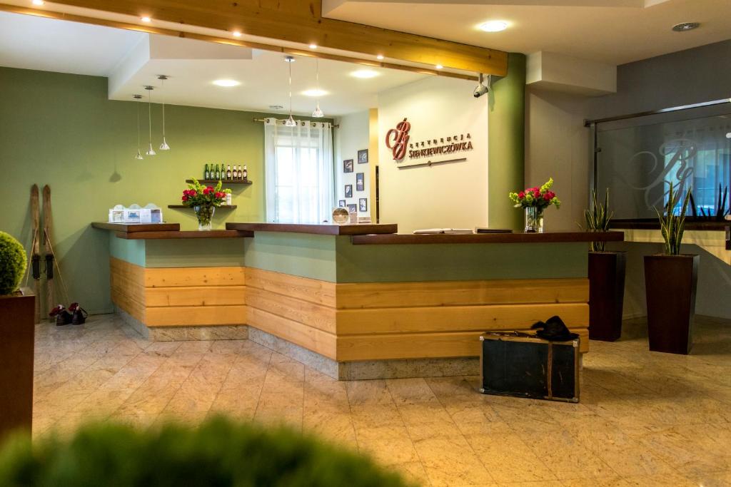 Lobby alebo recepcia v ubytovaní Rezydencja Sienkiewiczówka