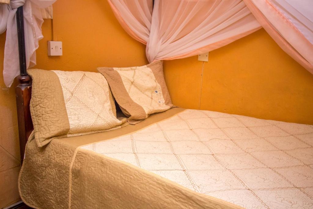 Postel nebo postele na pokoji v ubytování Hotel Nomad
