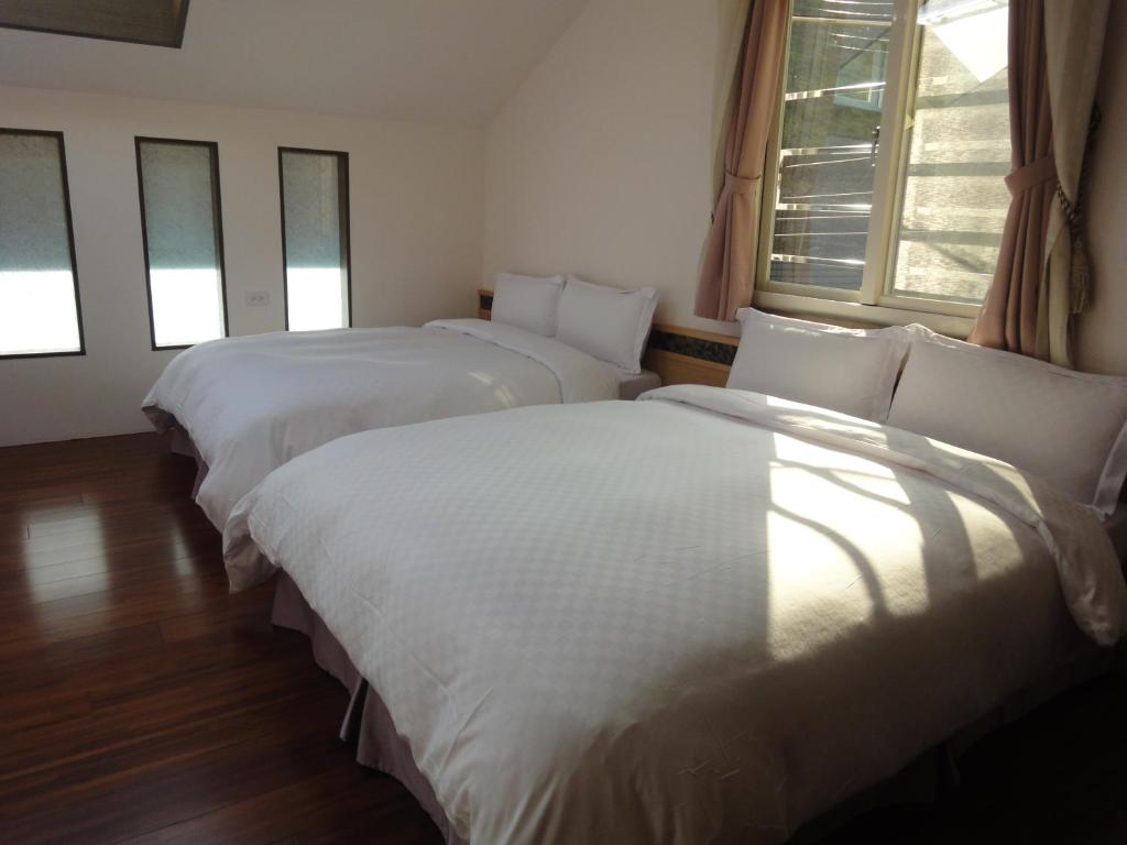 Postel nebo postele na pokoji v ubytování Natural Residence B&B