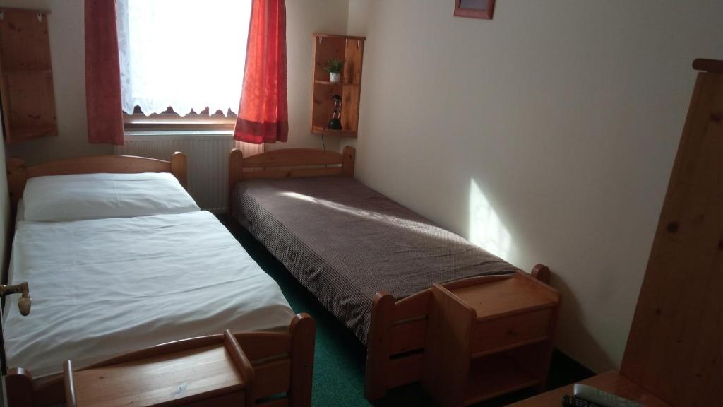 Postel nebo postele na pokoji v ubytování Hotel Bozi Dar - Excalibur