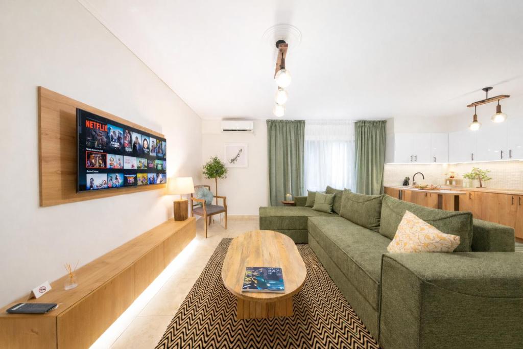 a living room with a couch and a table at Olive Aura in Mytilene