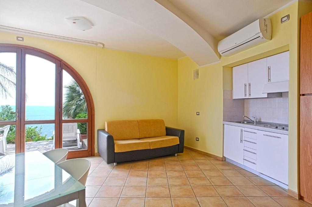 A kitchen or kitchenette at Le Terrazze Appartamenti Vacanze