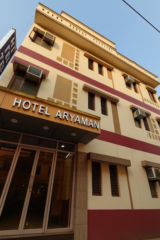 a hotel apartment building with a hotelarmaarma sign on it at Hotel Aryaman in Haridwār