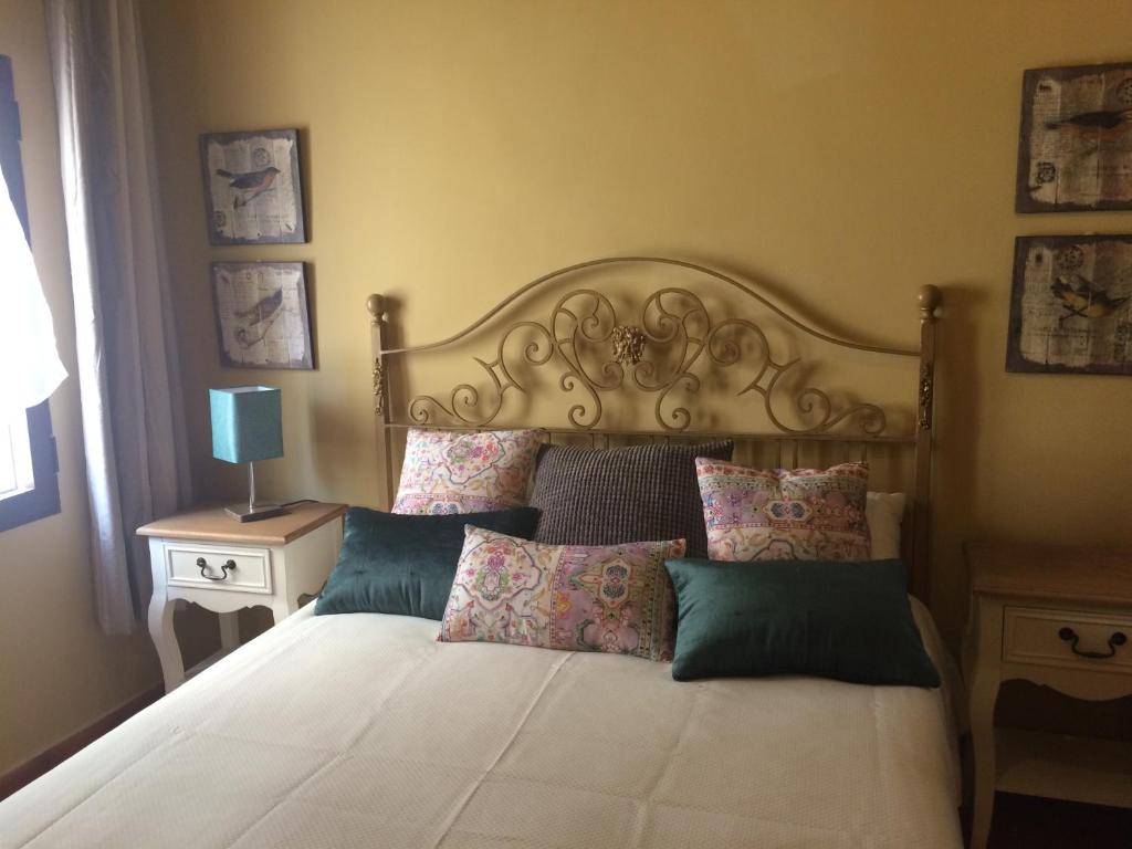 Postel nebo postele na pokoji v ubytování Apartamentos Coliseo