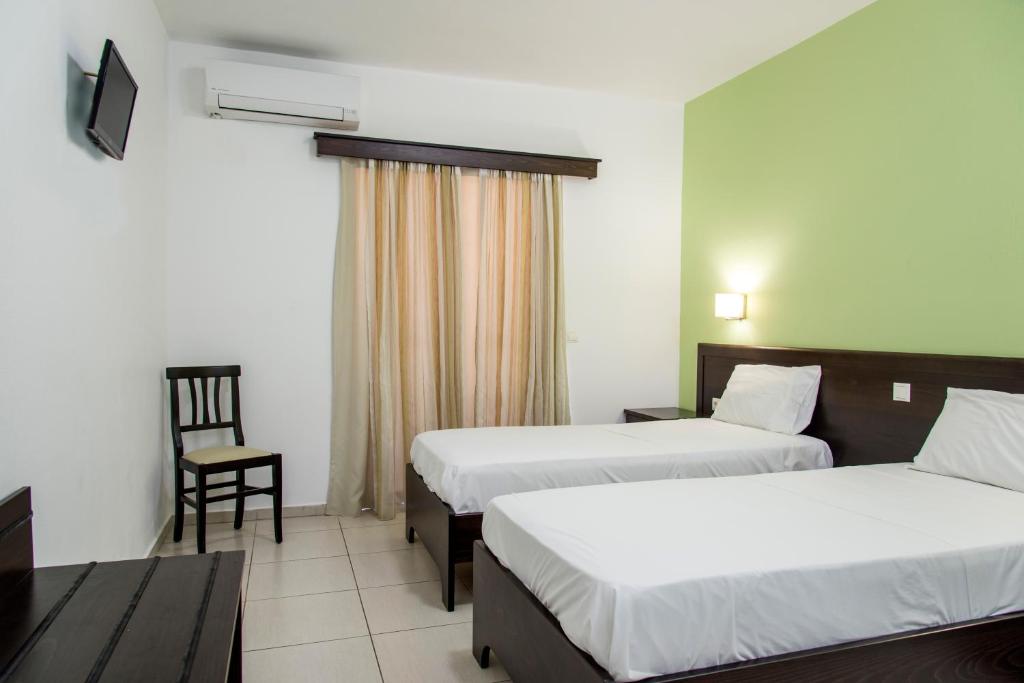 Postel nebo postele na pokoji v ubytování Rio Hotel