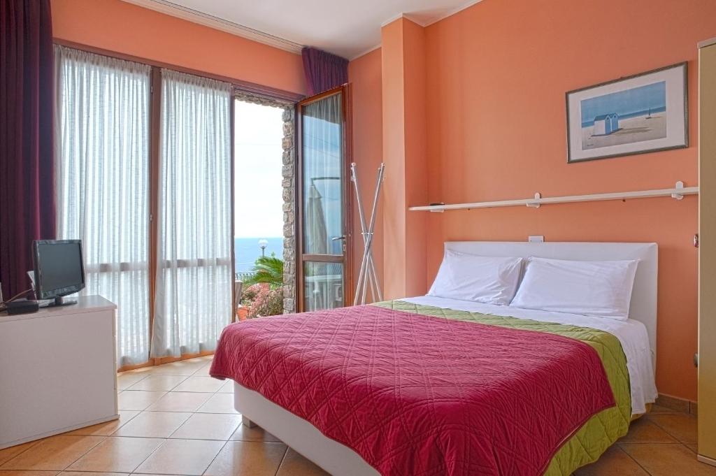 A bed or beds in a room at Le Terrazze Appartamenti Vacanze