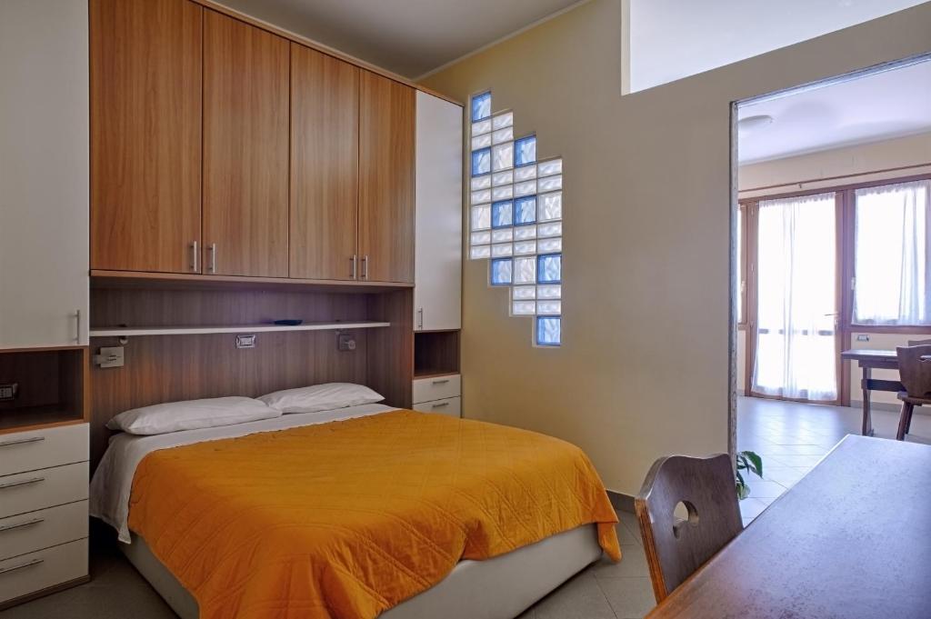 A bed or beds in a room at Le Terrazze Appartamenti Vacanze