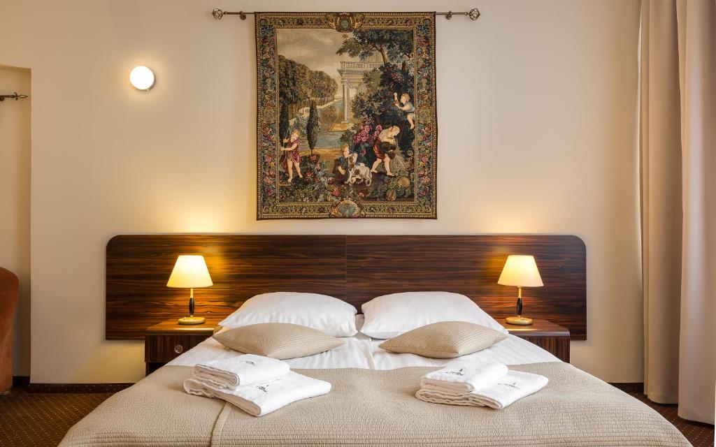 Posteľ alebo postele v izbe v ubytovaní Hotel Wit Stwosz