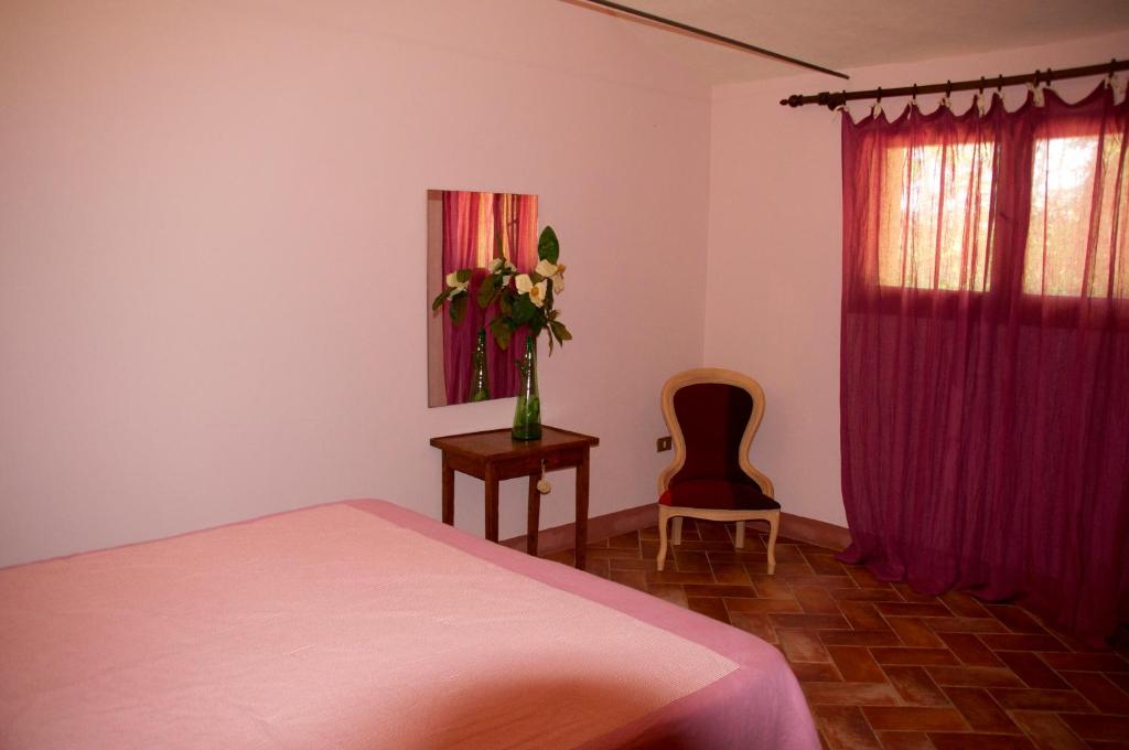 Postel nebo postele na pokoji v ubytování B&B Il Molinello