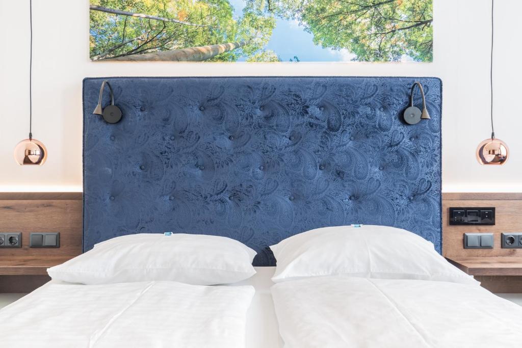 Postel nebo postele na pokoji v ubytování Hotel Eitljörg