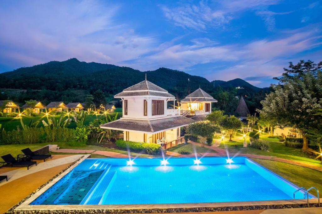 an aerial view of a villa with a swimming pool at Pai Vieng Fah Resort in Pai