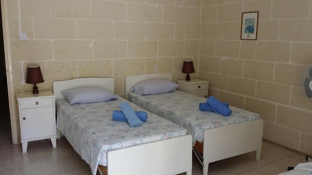 Postel nebo postele na pokoji v ubytování Maryanne-Joe Flats
