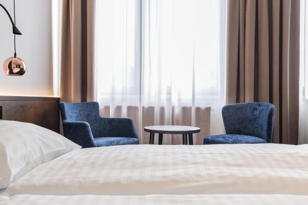 Postel nebo postele na pokoji v ubytování Hotel Eitljörg